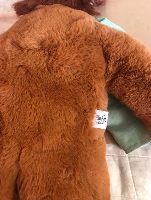 A teddy bear with a tag on it