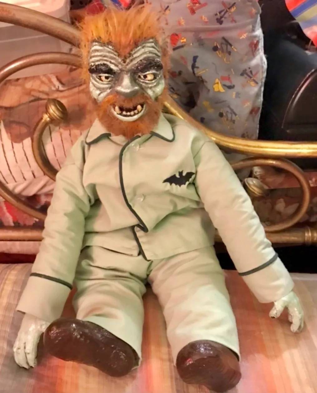 A doll of the werewolf is sitting on a chair.